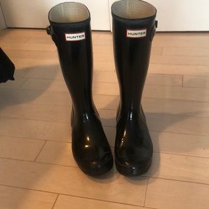 Black tall hunter boots
